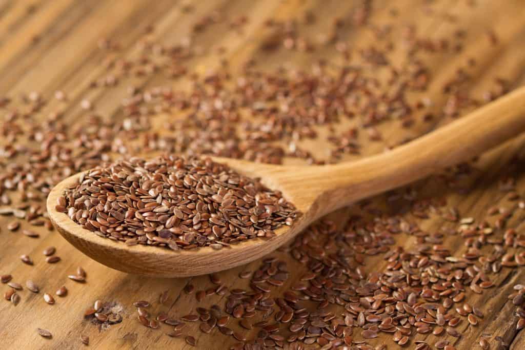 Flax seeds in wooden spoon