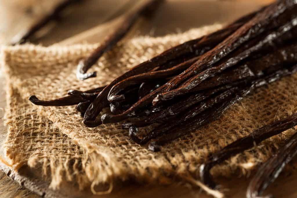 whole vanilla beans on burlap