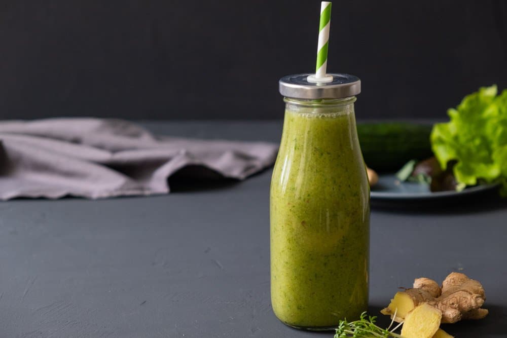 kale apple detox smoothie in glass container