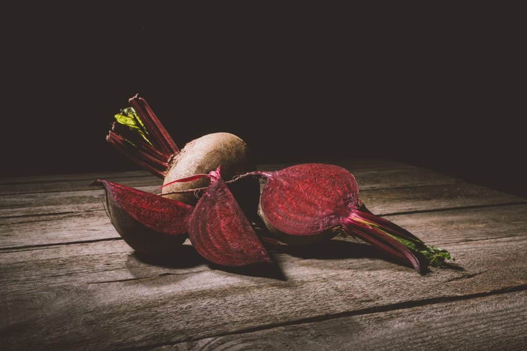 fresh beets on wooden table
