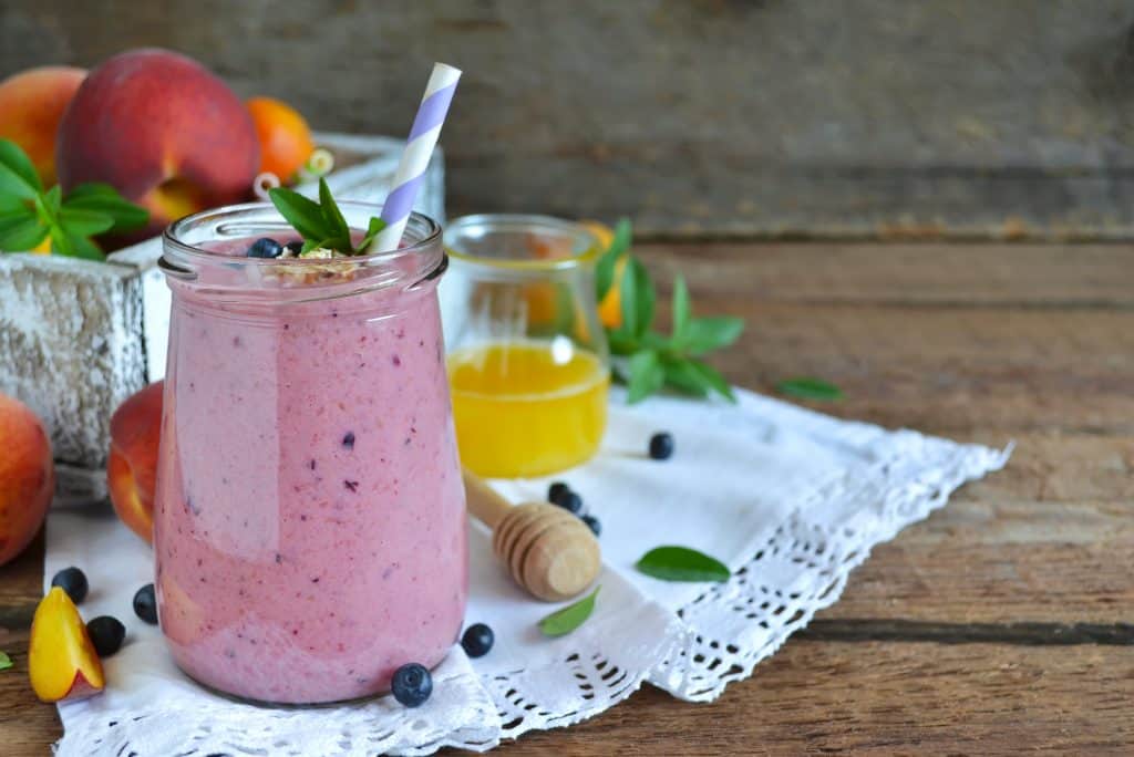 silken tofu smoothie in glass on wooden background