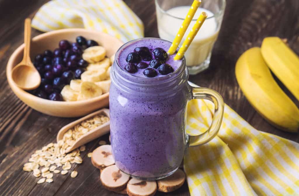 egg white smoothie for weight loss in glass with ingredients surrounding