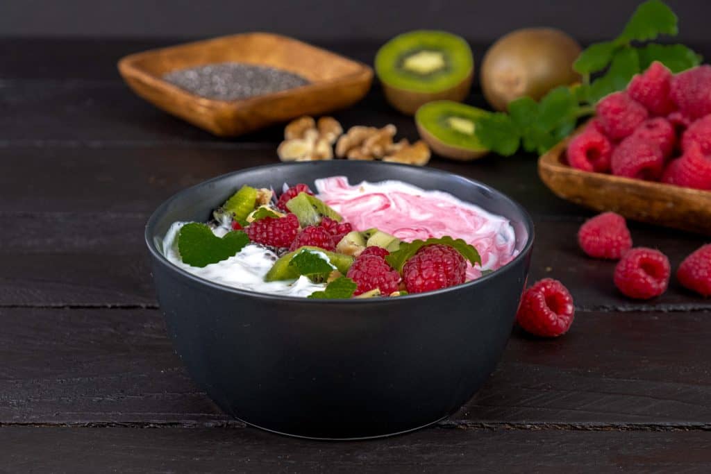 chia seed smoothie bowl with ingredients in background