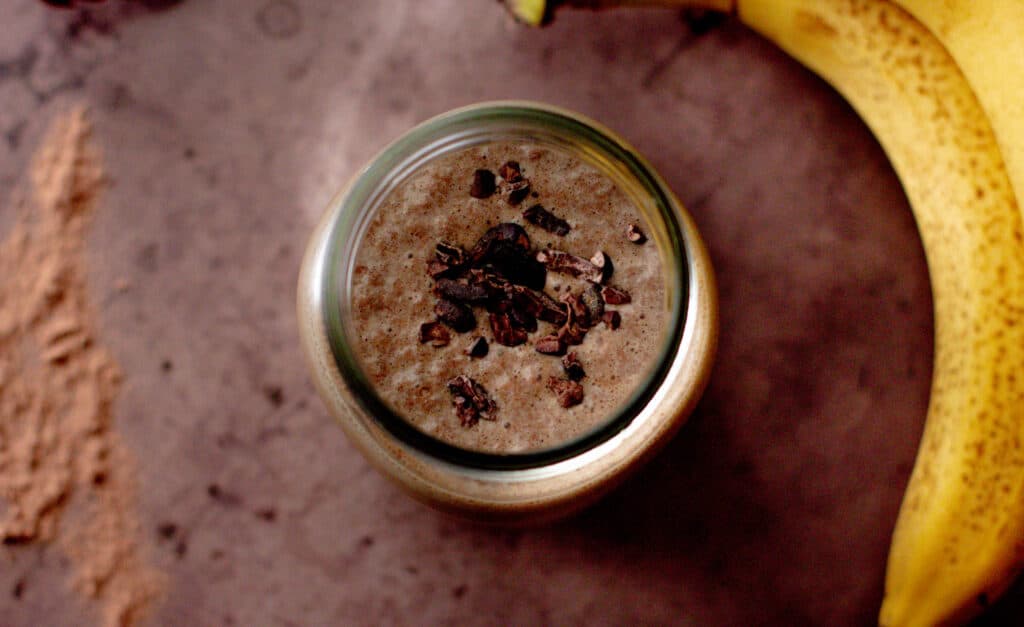top view of a nutella protein shake with cacao nibs