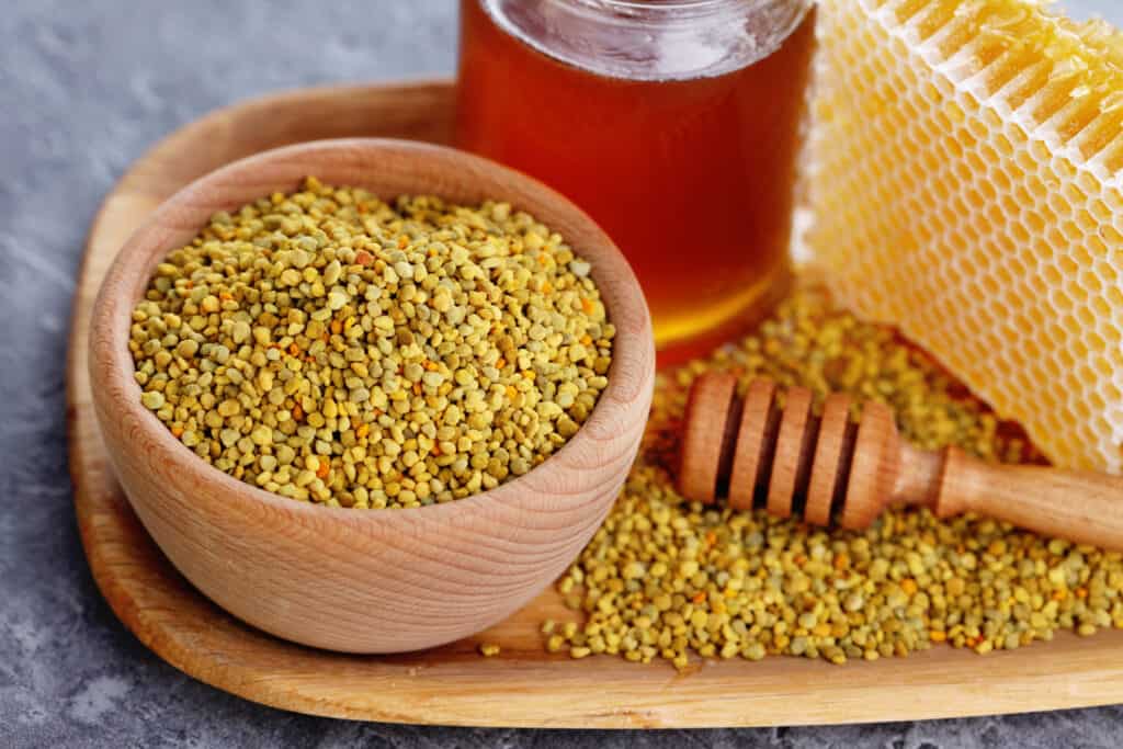 bowl full of bee pollen with honey comb